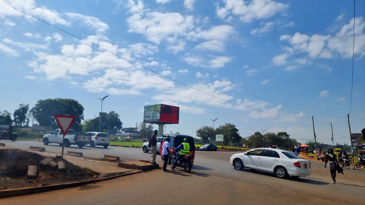 Traffic moving around the Kitale roundabout LED screen